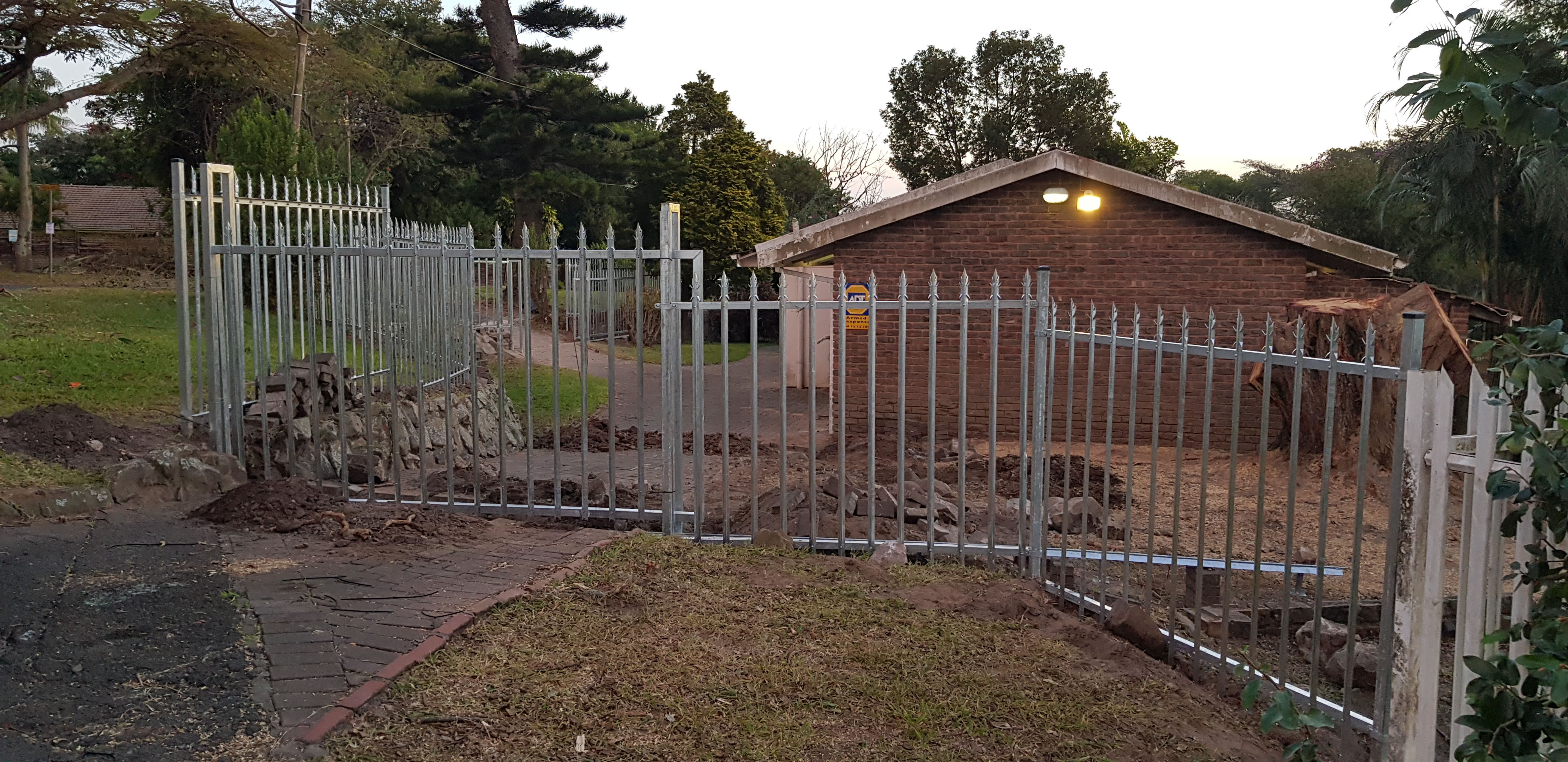 Installation of Steel Palisade Fencing in the backyard.